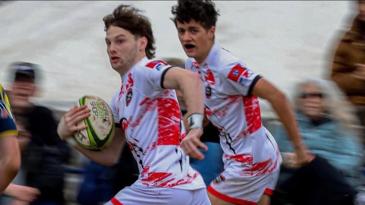 Senior fullback Wyatt Appleton with senior wing Ty Lavender in support.