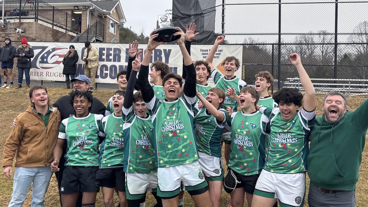 The Rebels celebrate their win.