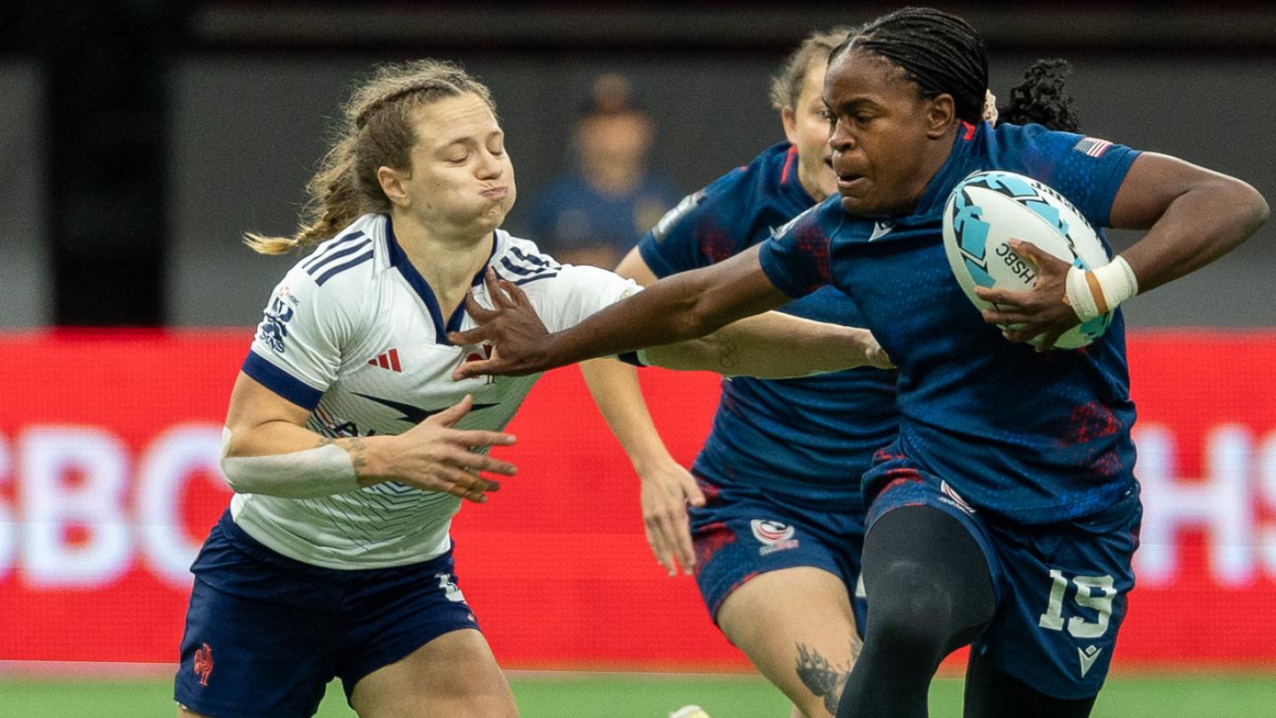 Kaylen Thomas fends off some French attention. Photo Alex Ho World Rugby.